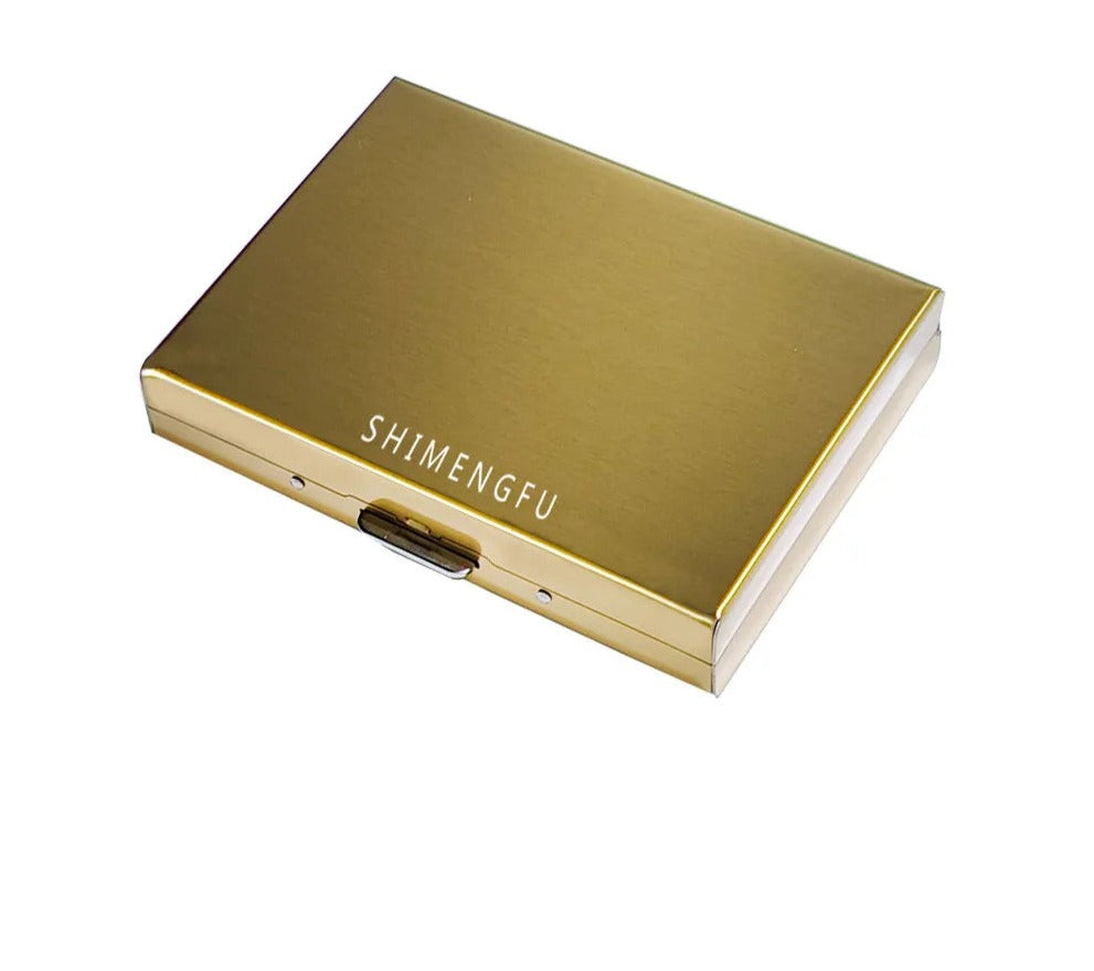 A gold version of the card organizer is presented, signifying an alternative color option, with the same brand name visible.