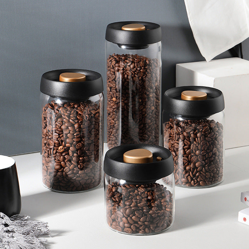 Glass Airtight Canister Set: A set of multiple Glass Airtight Canisters of varying sizes are shown, each filled with coffee beans. These containers offer a stylish and practical storage solution for your kitchen.