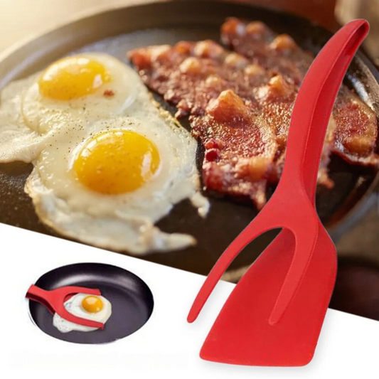 2 In 1 Grip And Flip Tongs holding fried eggs and bacon on a skillet. The tongs are red and help in flipping and gripping foods easily. Ideal for cooking eggs and bacon with ease.