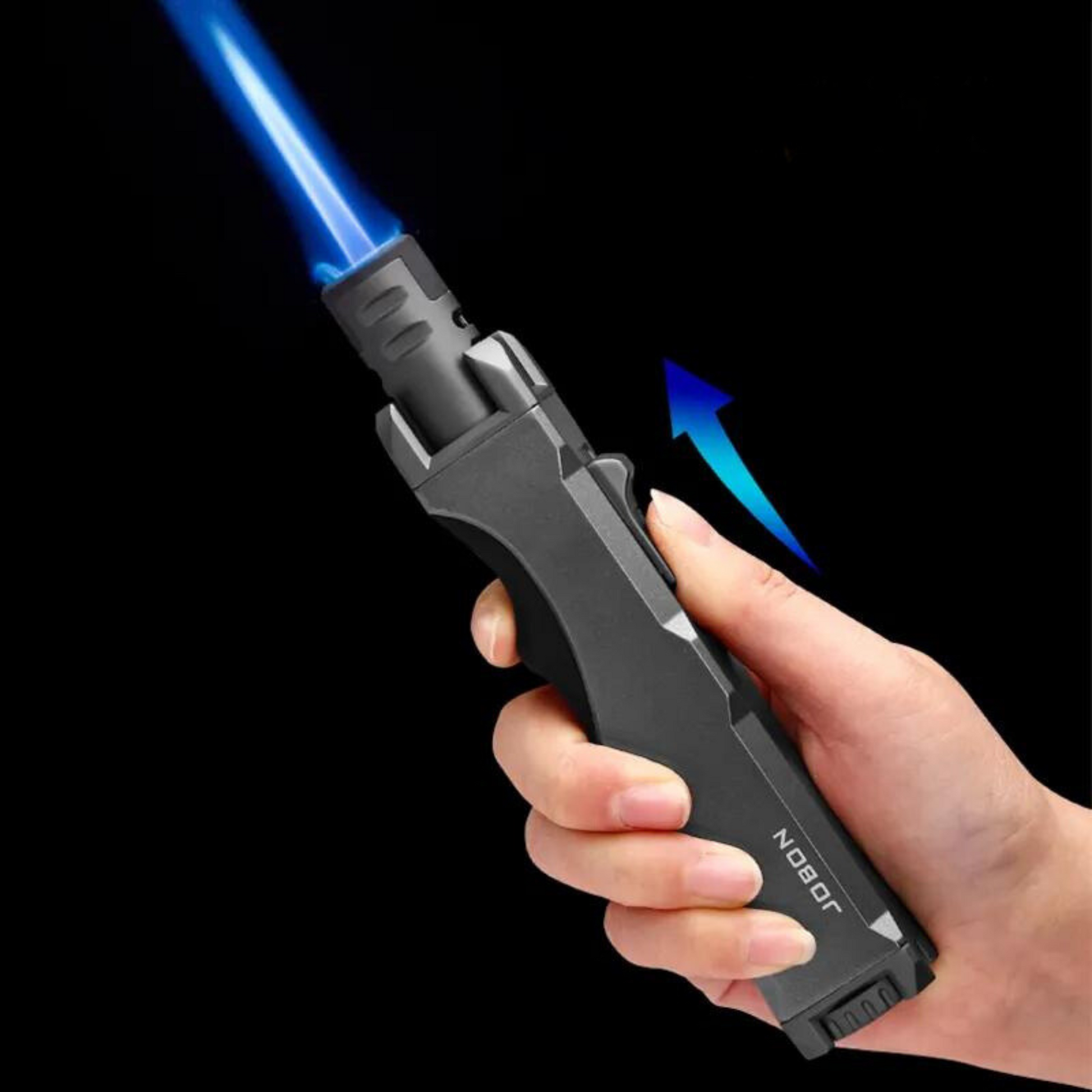 A person holds the windproof torch lighter with a blue flame, demonstrating its powerful and reliable ignition. Perfect for windy conditions, ensuring a stable flame.jet lighter